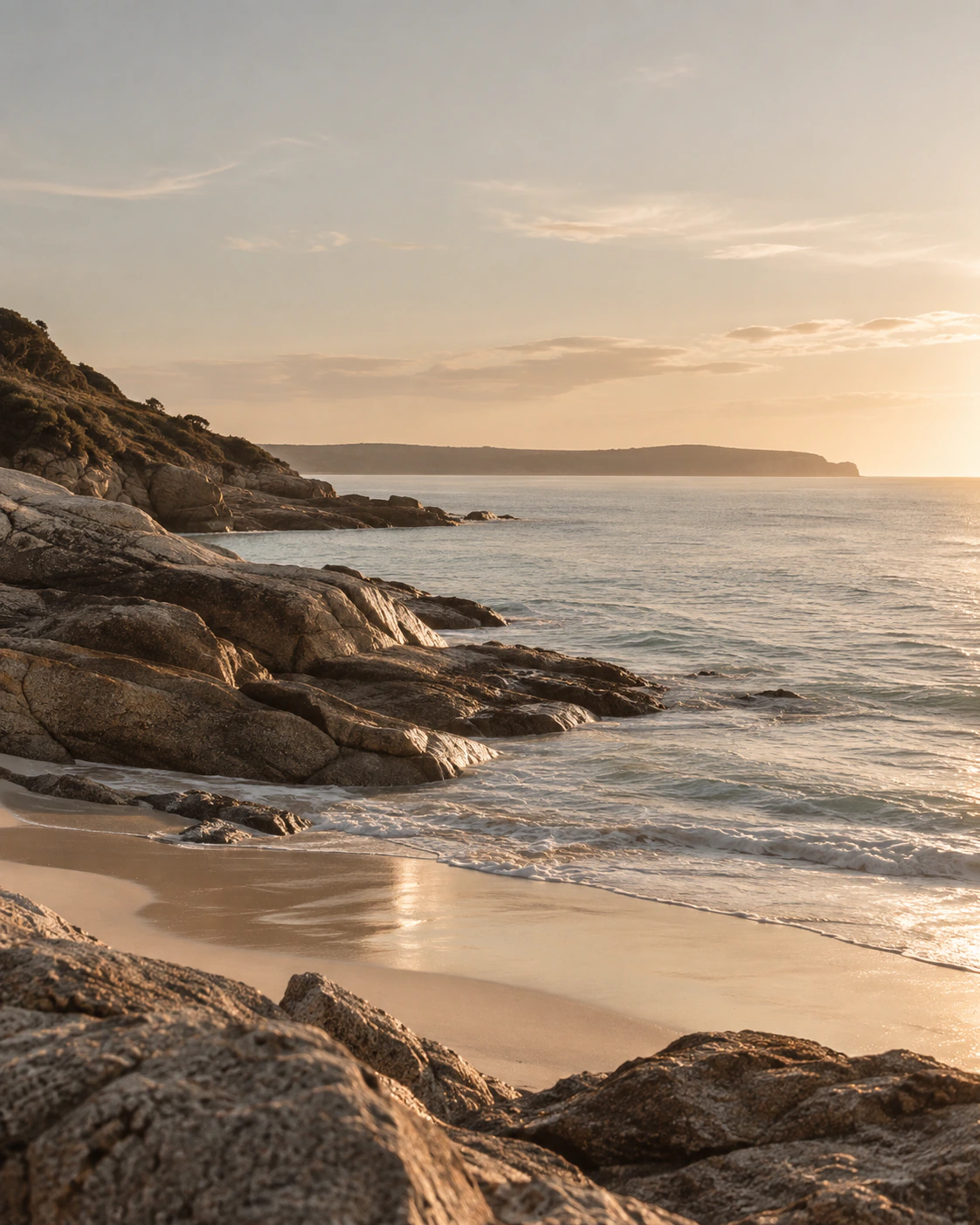 Calm ocean shoreline under a clear Australian sky