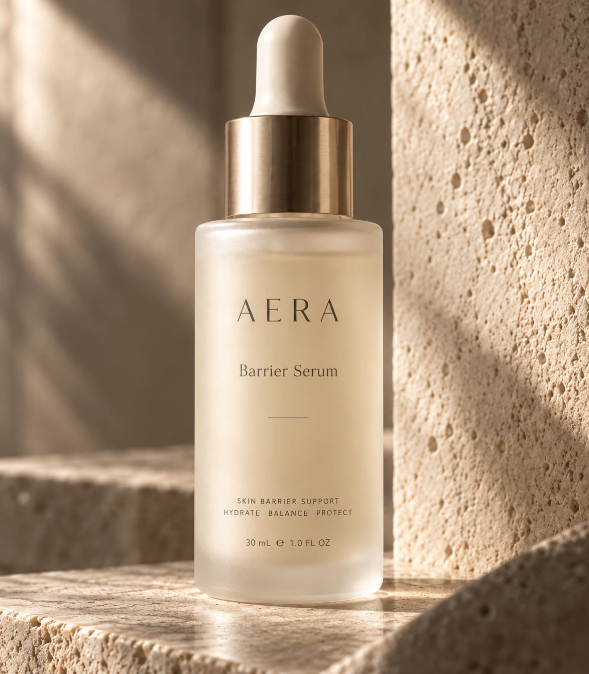 Amber serum dropper arranged on pale stone in warm directional light